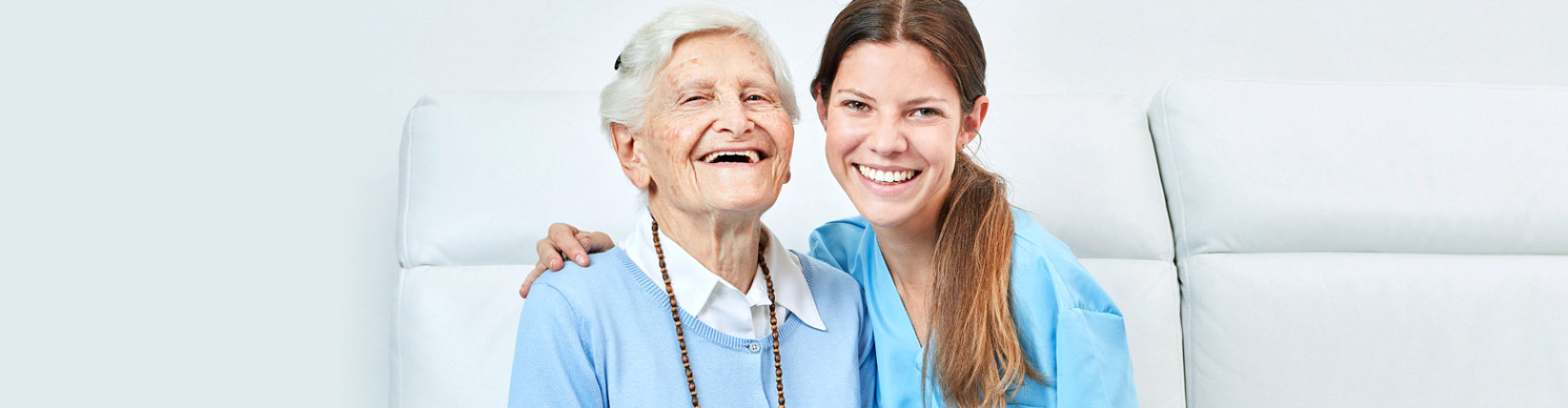 happy senior woman with her caregiver